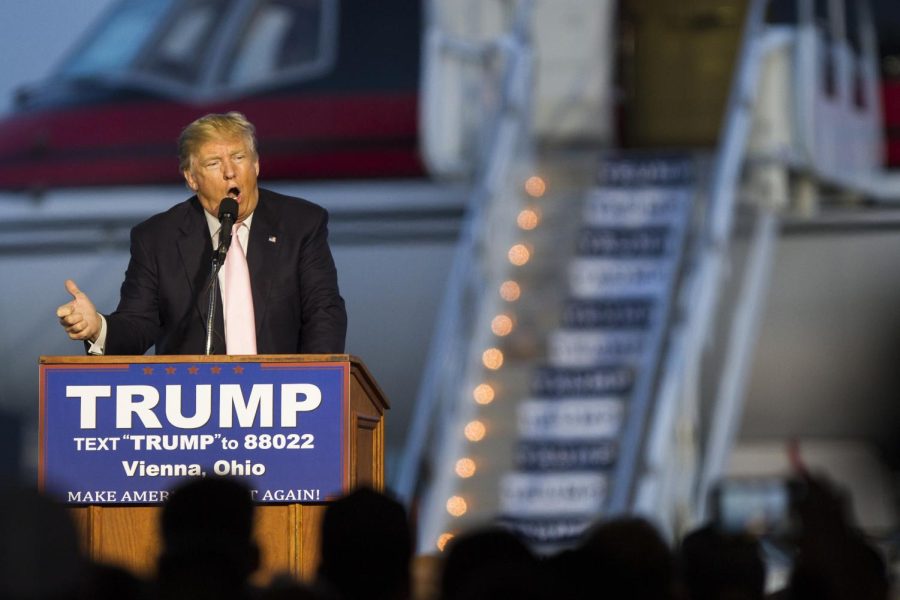 Republican presidential nominee Donald Trump speaks to supporters at Winner Aviation in Vienna, Ohio, on Monday, March 14, 2016.