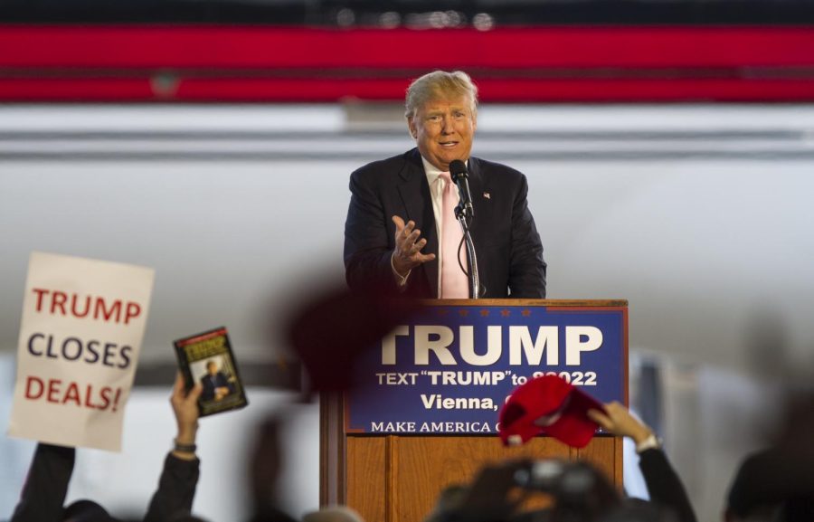 Republican presidential candidate Donald Trump speaks to supporters at Winner Aviation in Vienna, Ohio, on Monday, March 14, 2016.