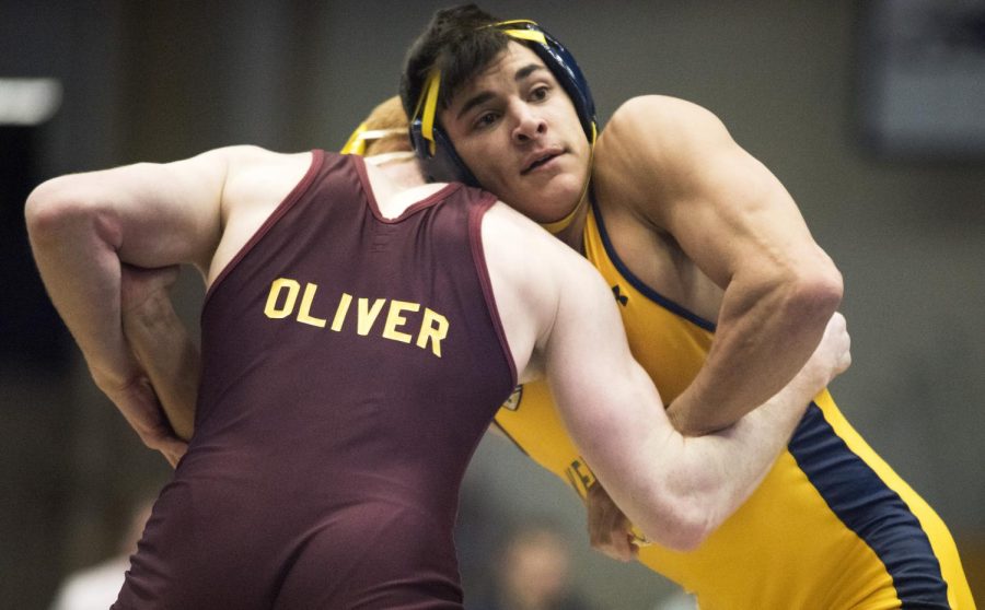 Fifth-year starter Mike Depalma grapples for position in the clinch against Justin Oliver of Central Michigan University on Sunday, Feb. 14, 2016 at the M.A.C. Center.