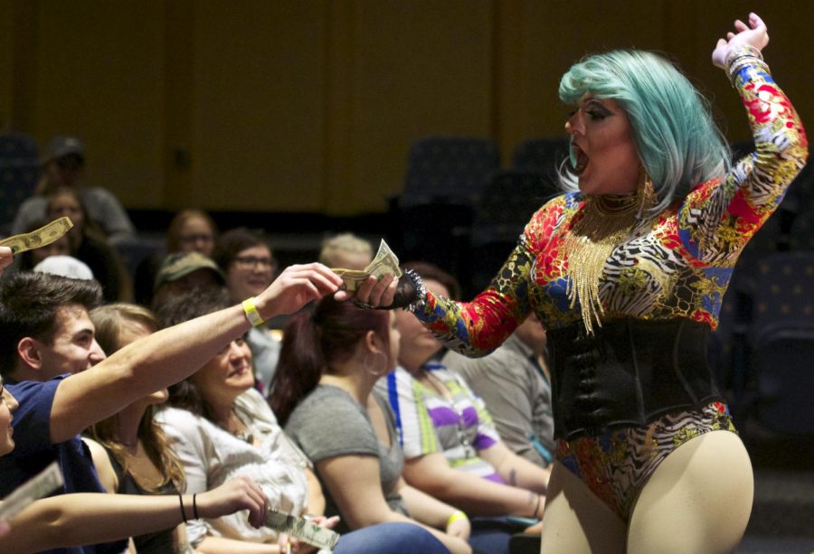 Khloe Chanel Statton collects tips from audience members during the Green with Envy drag show in the KIVA hosted by Delta Lamda Phi on Saturday March 5, 2016.