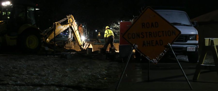 Maintenance crews work on a broken water main at Manchester Field on Thursday, March 3, 2016. The water main break caused the Student Center to close early Thursday night.