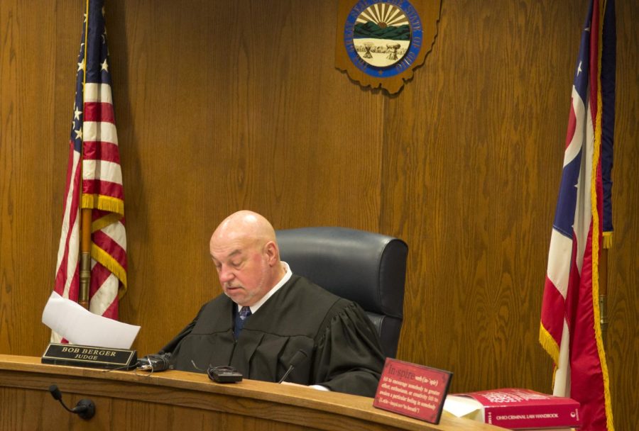 Judge Bob Berger listens to the prosecutor and defense during Friday morning's hearing for one of the suspects of the Ryan Place homicide.