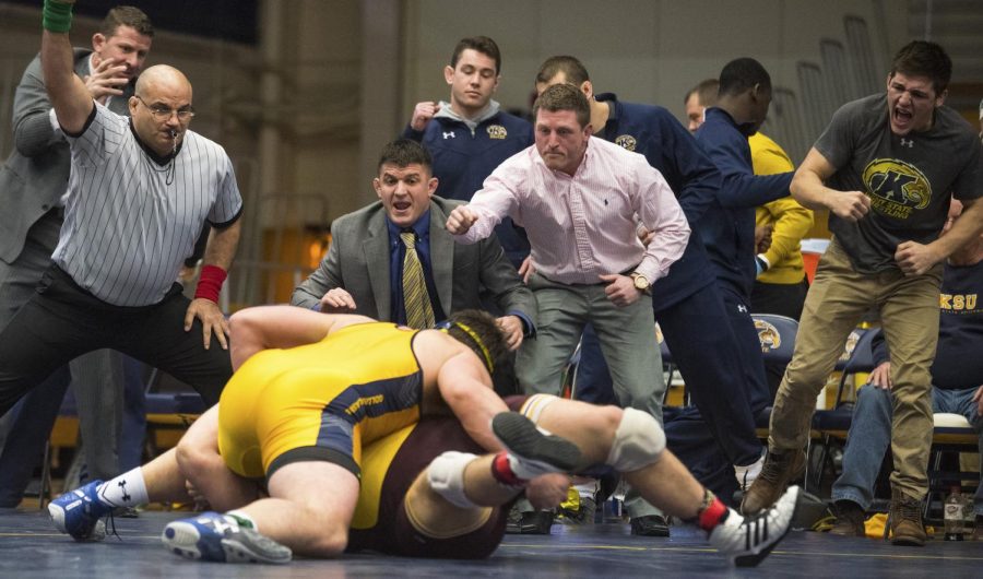 The Kent State sidelines react as redshirt freshman Devin Nye attempts to pin his Central Michigan University opponent on Sunday, Feb. 14, 2016 at the M.A.C. Center.