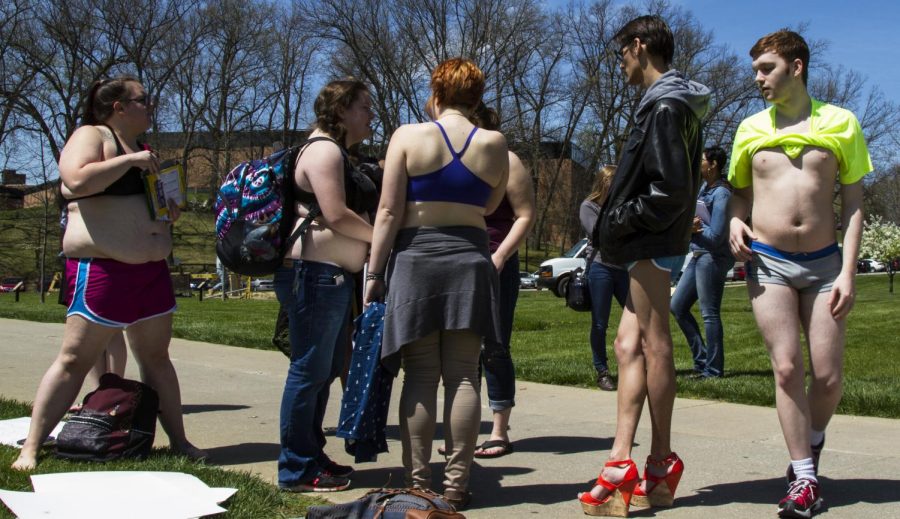 Kent State's Students Against Sexual Assault group finish preparing their signs before the Walk of Power on Wednesday, April 27, 2016. The group were marching to raise awareness regarding sexual assault and violence.