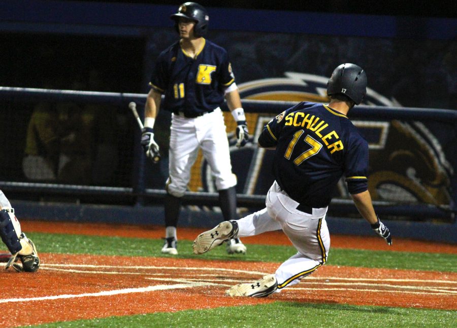 Freshman catcher Pete Schuler slides into home on Wednesday April 20, 2016. Kent beat Penn State 10-9.