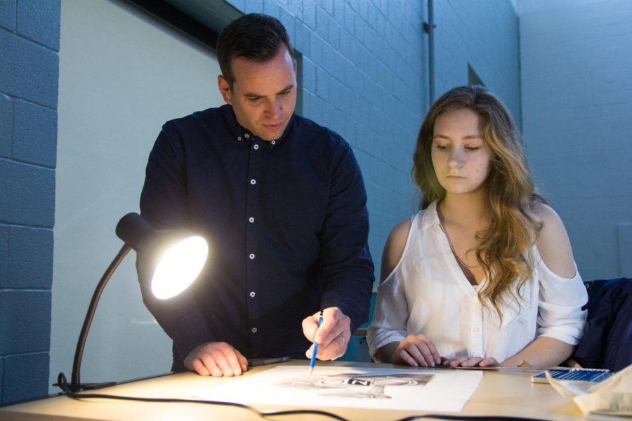 Visual Communication Design professor helps sophomore Emily Gommel on her still life assignment during a Design Illustration Techniques I class on Thursday, March 10, 2016.