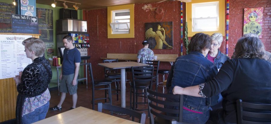 Customers fill the dinning room of Taco Tantos on Saturday, April 16, 2016.