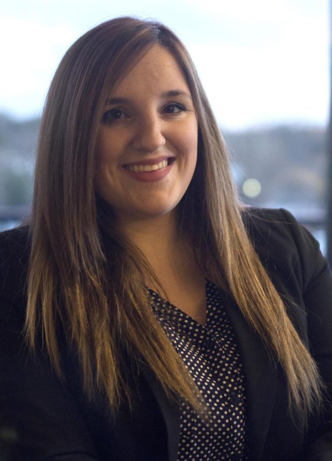 Katie Kimble, a junior entrepreneurship major, sits in the clubhouse at Province Apartments on Wednesday, March 16, 2016. She was recently named “Biggest Winner” by WKYC TV and has given back to the community in many ways.