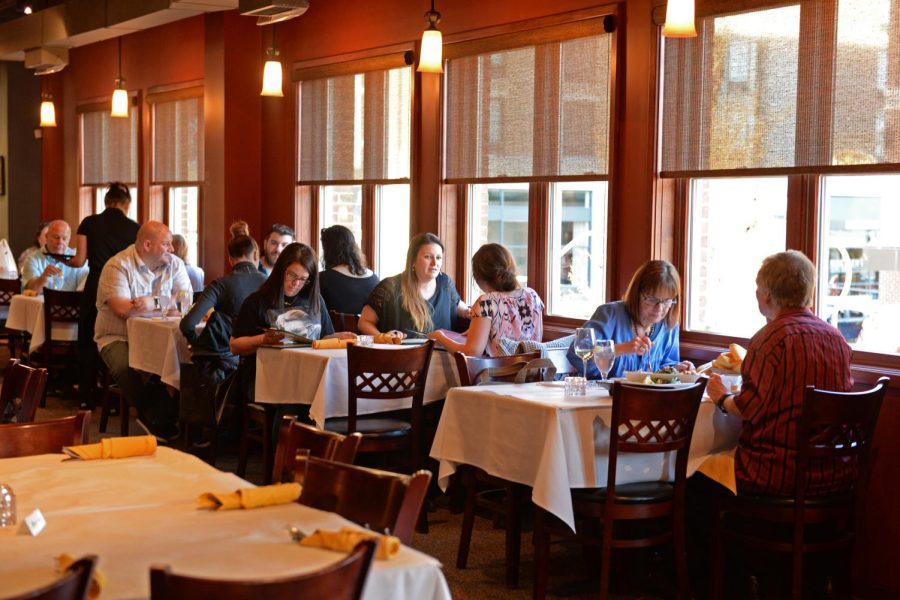 Customers enjoy the atmosphere of Laziza as they order food on Friday, April 16, 2016. Laziza offers a wide variety of ethnic and vegetarian dishes.