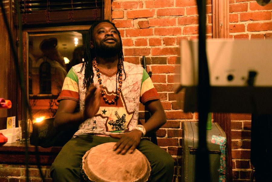 Dontty Lakina, a drummer of Outlaws 1&amp;1, performs for the crowd at Ray’s Place in downtown Kent, Ohio, for Reggae Fest on Saturday, April 23, 2016.