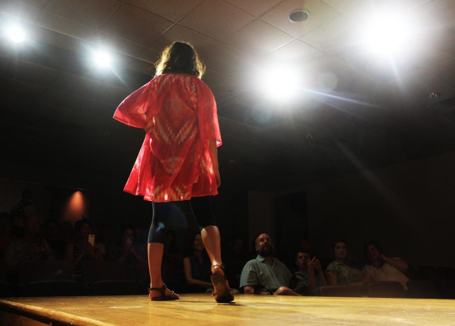 Ashley Renehan, a high school student of this year's Kent State Fashion School Summer Academy, displays her garment on the runway in Rockwell Hall of the Fashion School on Saturday, June 25, 2016.