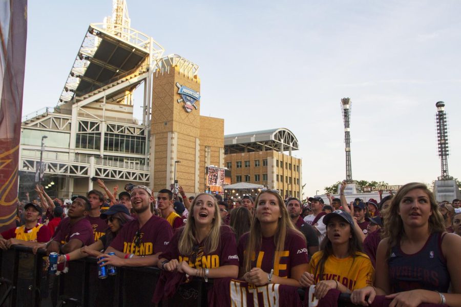 Fans watch on in excitement at the Cavaliers watch party outside the Quicken Loans Arena in downtown Cleveland on Sunday, June 19, 2016. The Cavaliers went on to defeat the Golden State Warriors, 93-89, to capture the city of Cleveland’s first major championship in 52 years.