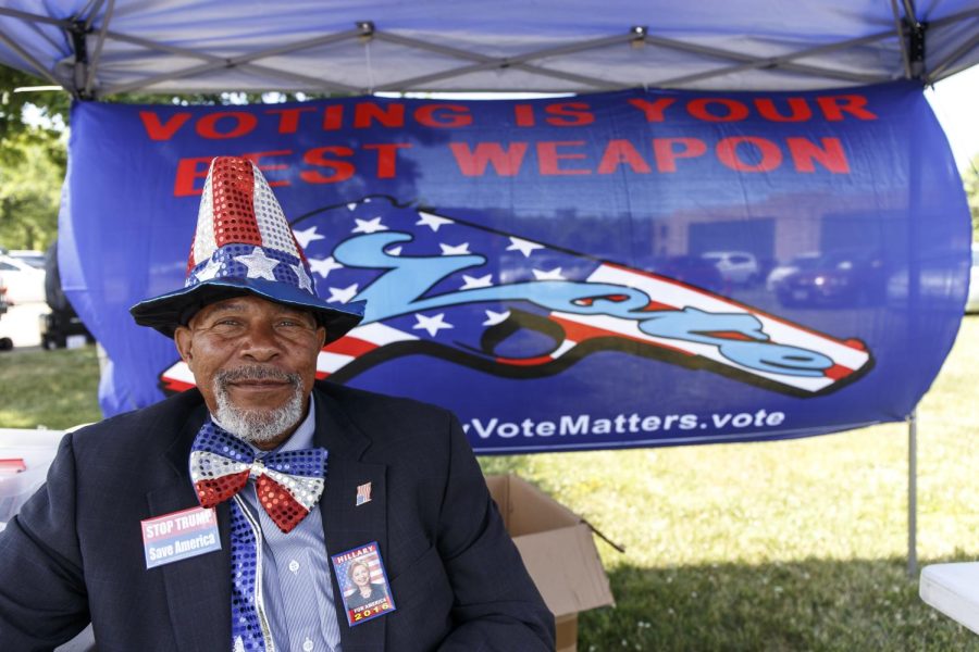 Siddiq Mumin, national director of the Citizens' Super PAC for America, sits at his donation booth outside Hillary Clinton’s rally at the Cleveland Industrial Innovation Center in East Cleveland on Monday, June 13, 2016.