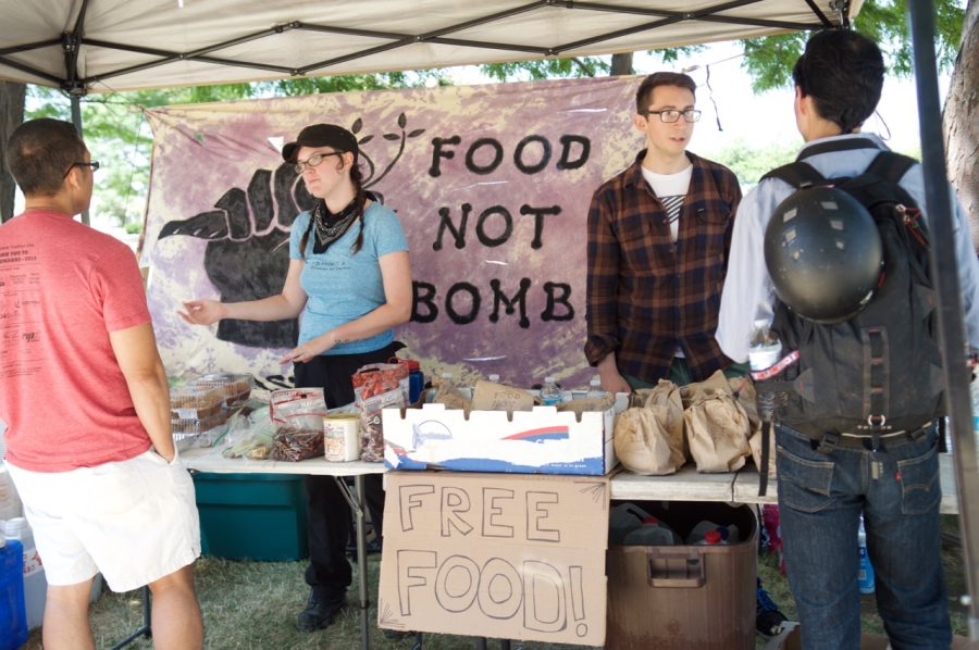 The Food Not Bombs nonprofit organization offers food to protestors in downtown Cleveland's Willard Park on Tuesday, July 19, 2016. 