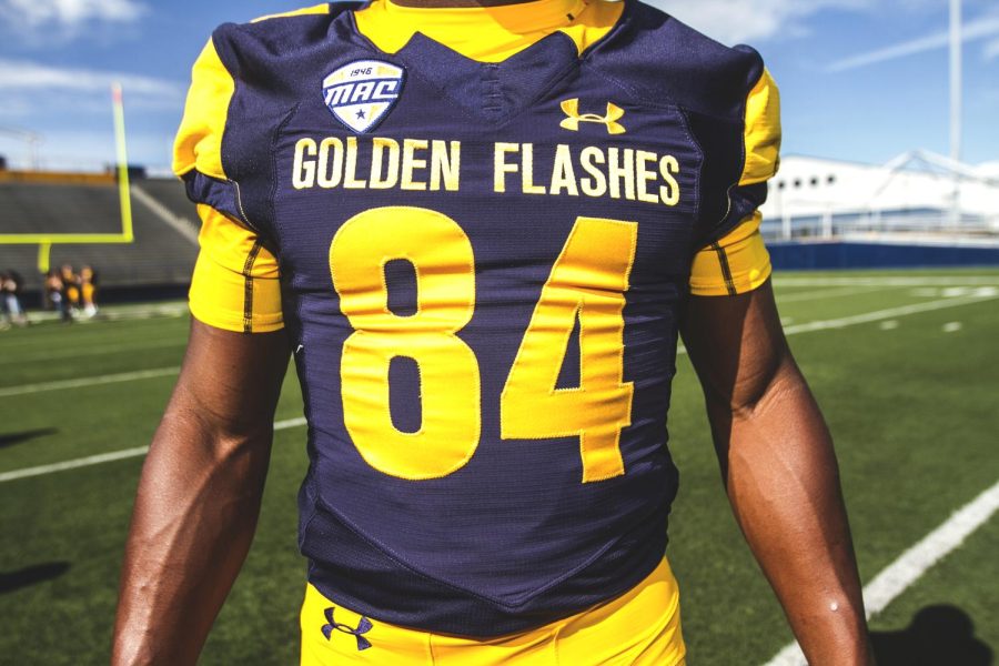 Freshman wide receiver Kavious Price models Kent State’s new Under Armour jerseys for the 2016-2017 season at the football team’s media day at Dix Stadium on Sunday, Aug. 7, 2016.