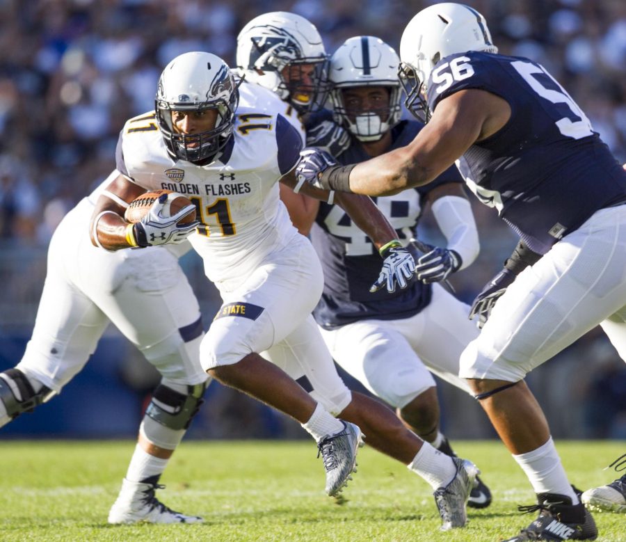 Freshman running back Justin Rankin runs the ball during the first half of the game against Penn State on Saturday, Sept. 3, 2016 at Beavers Stadium. Kent State lost their season opener, 33-13.