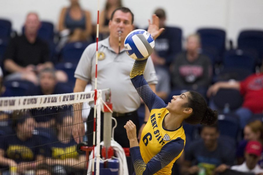 Junior Heather Younkin hits the ball over the net against Robert Morris University on Tuesday, Sept. 6, 2016. Kent State won, 3-0.