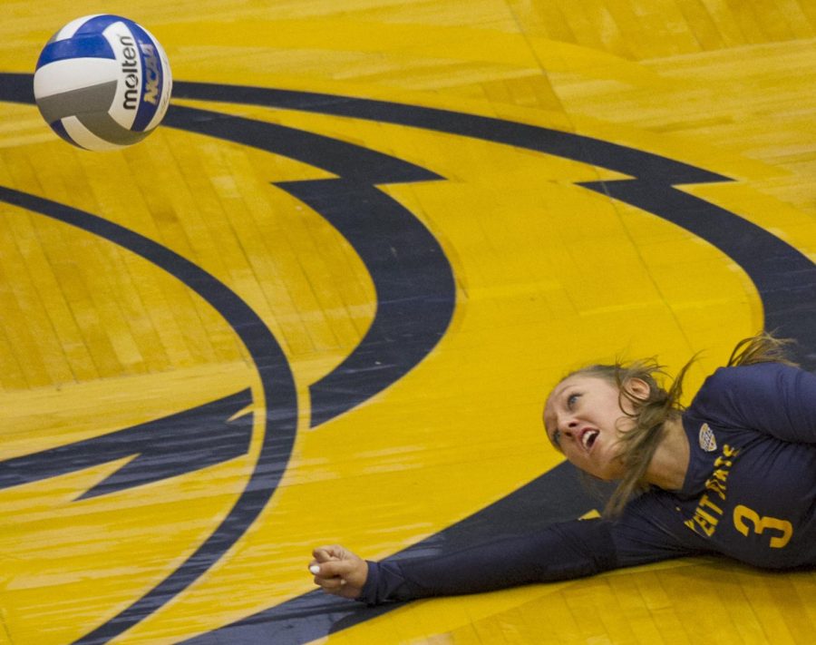 Junior Challen Geraghty dives for the ball against Robert Morris University on Tuesday, Sept. 6, 2016 at the M.A.C. Center. Kent State won, 3-0. Friday night's game ended with the Flashes losing their five-game win streak to the University of Miami RedHawks, 3-0.