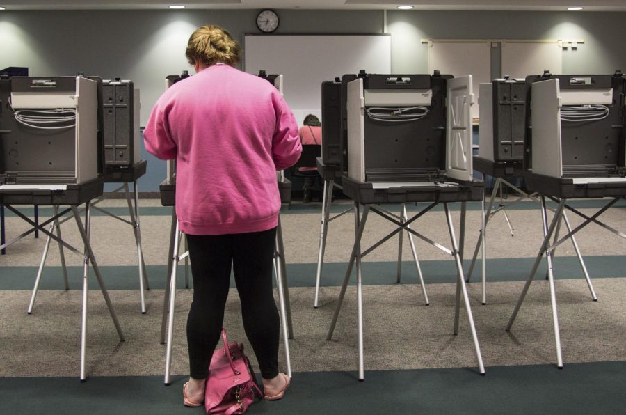 Freshman Elizabeth Nunemaker votes at the Student Recreation and Wellness Center on Tuesday March 15, 2016. Ohio is one of the five states to vote in the primaries on this day.