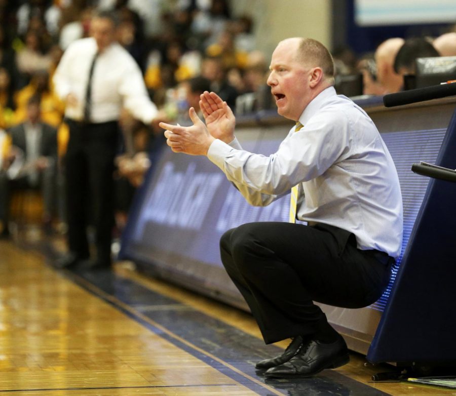 Kent State men's basketball head coach Rob Senderoff cheers on the Flashes against the University of Akron on Friday, Feb. 19, 2016 in Kent, Ohio, at the M.A.C. Center. The Golden Flashes won the game 85-76.