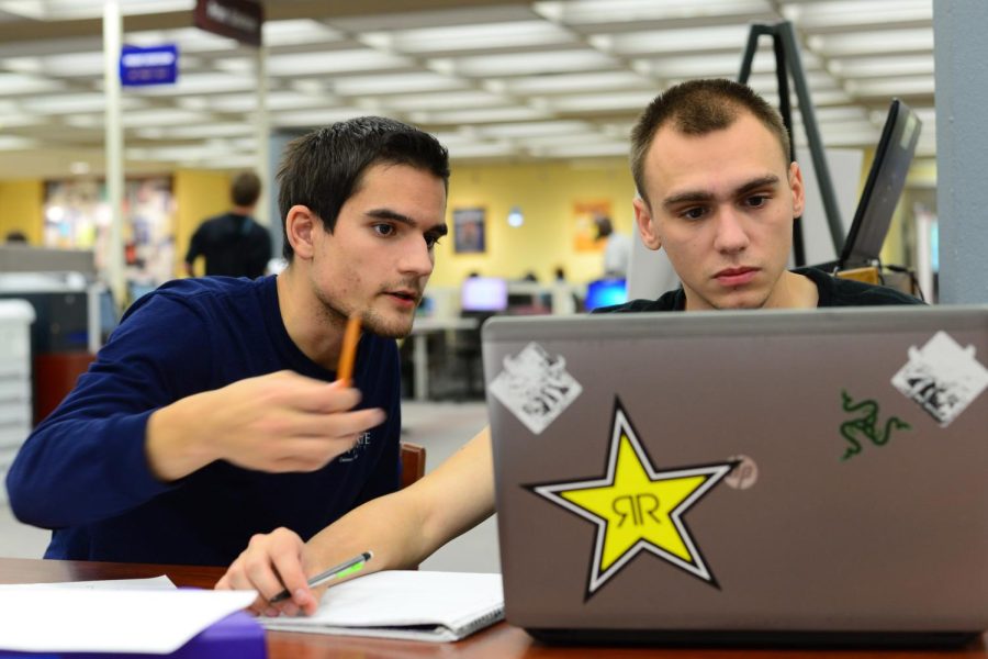 David Carlyn, junior computer science major, tutors sophomore aeronautics major, Keith Wright, in math at the tutoring center on the first floor of the library on Oct. 5, 2016.