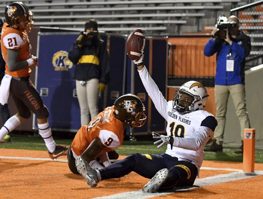 Freshman defensive back Jamal Parker intercepts the ball for a touchback in Kent State's game against Bowling Green State University on Tuesday, Nov. 15, 2016.