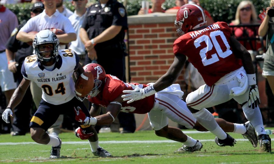 Freshman widereceiver Kavious Price is tacked by the University of Alabama’s Crimson Tide’s junior redshirt defensive back Anthony Averett during a play in a game at Bryant-Denny Stadium on Saturday, Sept. 24, 2016. The Flashes lost 48-0.