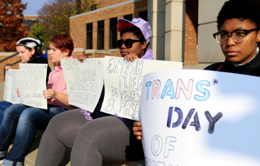 Junior nursing major Liz Kleinhenz, freshman science education major Cameron Smyk, sophomore theatre studies major Rue Monroe and sophomore zoology major Jordin Manning sit in front of the M.A.C Center in support of Transgender Day of Remembrance on Thursday, Nov. 17, 2016.