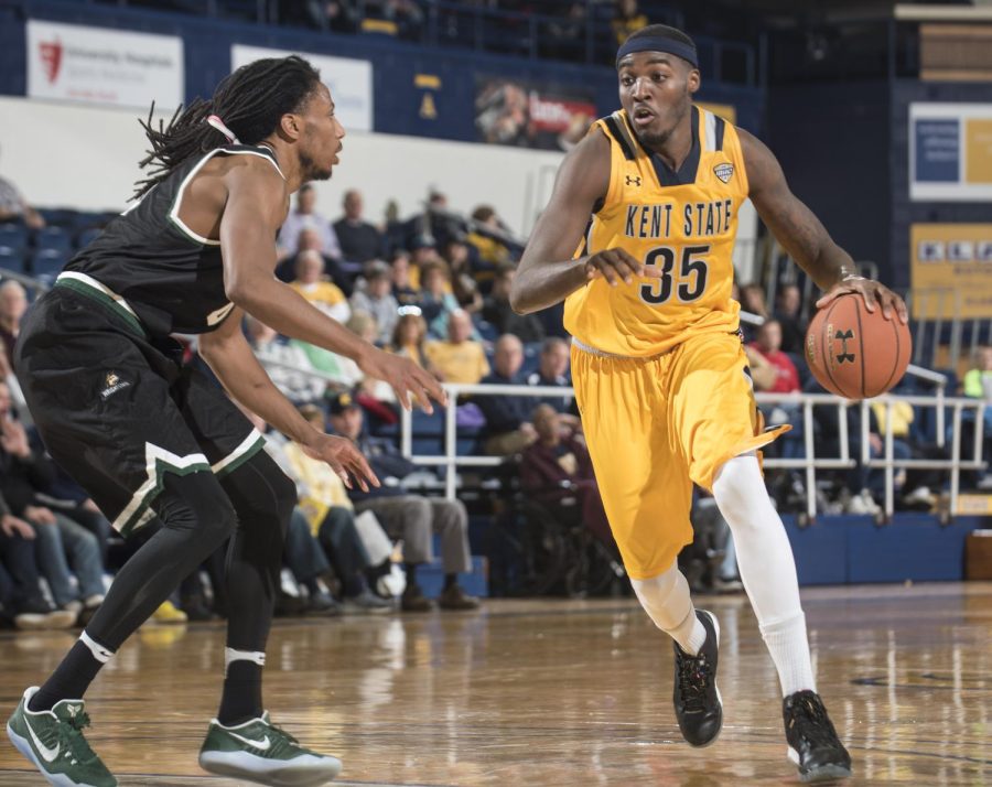 Senior forward Jimmy Hall Jr. drives to the rim against the Wright State University defender on Sunday, Dec. 18, 2016 at the M.A.C. Center. 