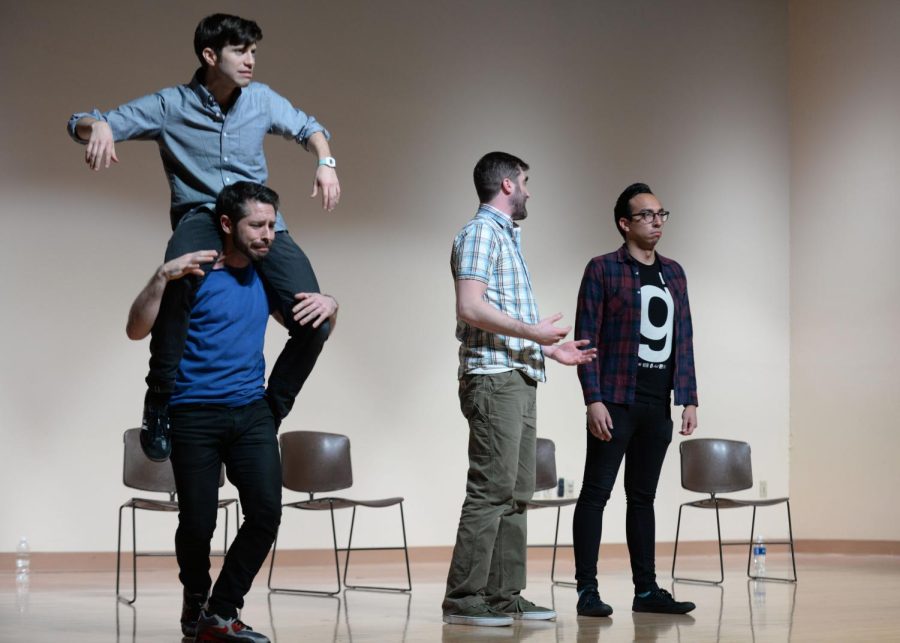 Matthew Rubano, Matthew Starr, Tanner Dahlin and Andy Bustillos of the Upright Citizens Brigade Touring Company perform an improvised skit based on text messages read from the audience’s phones on Friday, Dec. 2, 2016 in Kent State's KIVA.