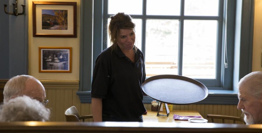 Karry Stanton serves a group of customers at the Pufferbelly on downtown Kent's Franklin Avenue on Wednesday, April 20, 2016.