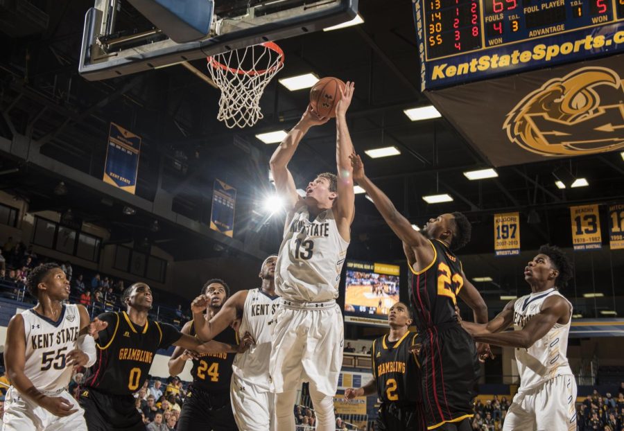 Freshman guard Mitch Peterson of the Kent State men's basketball team shoots a layup after collecting the offensive rebound against Grambling State University on Friday, Dec. 2, 2016 at the M.A.C. Center. Kent State won, 86-57.