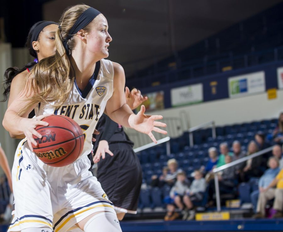 Kent State sophomore forward Jordan Korinek pivots around a Northern Illinois defender at the M.A.C. Center on Wednesday, Jan 11, 2017.