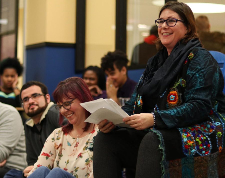 Keynote speaker Molly Merryman and assistant professor of LGBTQ studies Lauren Vochon listen to the conclusion of the LGBTQ Student Center Spring Kick Off in the Nest on Tuesday, Jan. 24, 2017. “The most radical act you can have when you feel unwelcome is to succeed,” said Merryman. Merryman’s speech encouraged the LGBTQ community to find their support systems and to continue to succeed in the face of adversity.