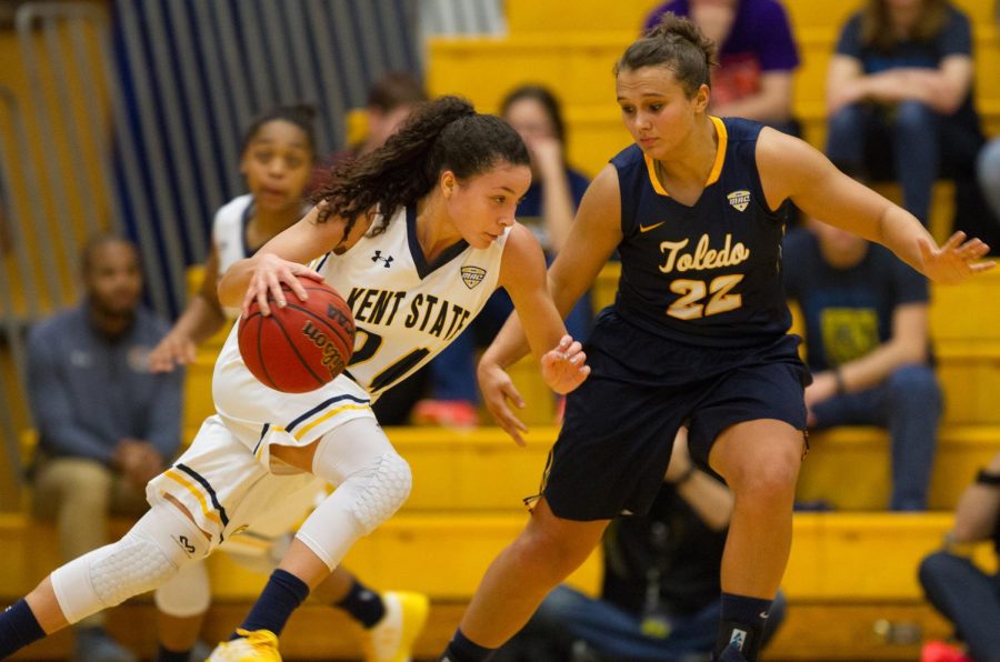 Kent State sophomore guard Alexa Golden drives to the basket against the Toledo Rockets defender on Saturday, Jan. 21, 2017.