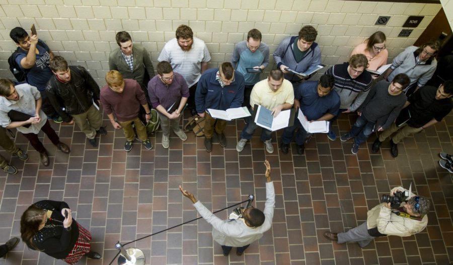 Bryon Black, director of the Kent State Men’s Chorus, directs the chorus at the Kent State Nursing School’s 50th anniversary in Henderson Hall Jan 23, 2017.