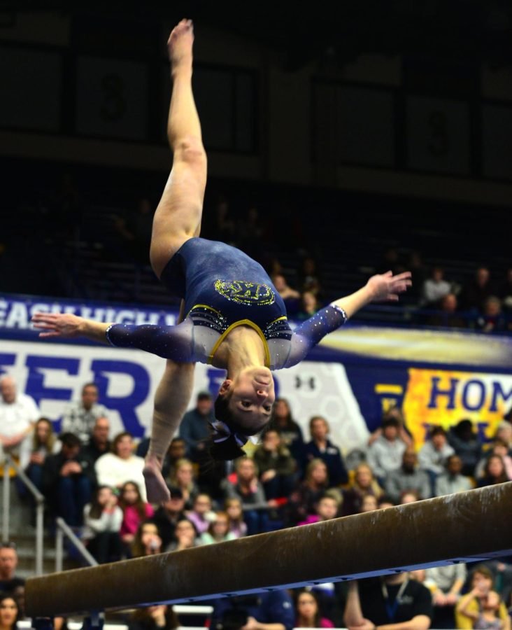 Senior Milena Fabry performs on the balance beam at the woman's gymnastics meet on Jan. 20, 2017.