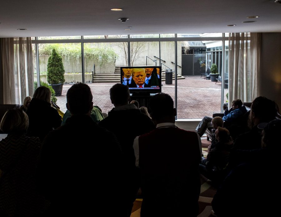 A crowd gathers at the Holiday Inn outside the National Mall in Washington, D.C. to watch the inauguration ceremony of President Donald Trump on Friday, Jan. 20, 2017. 