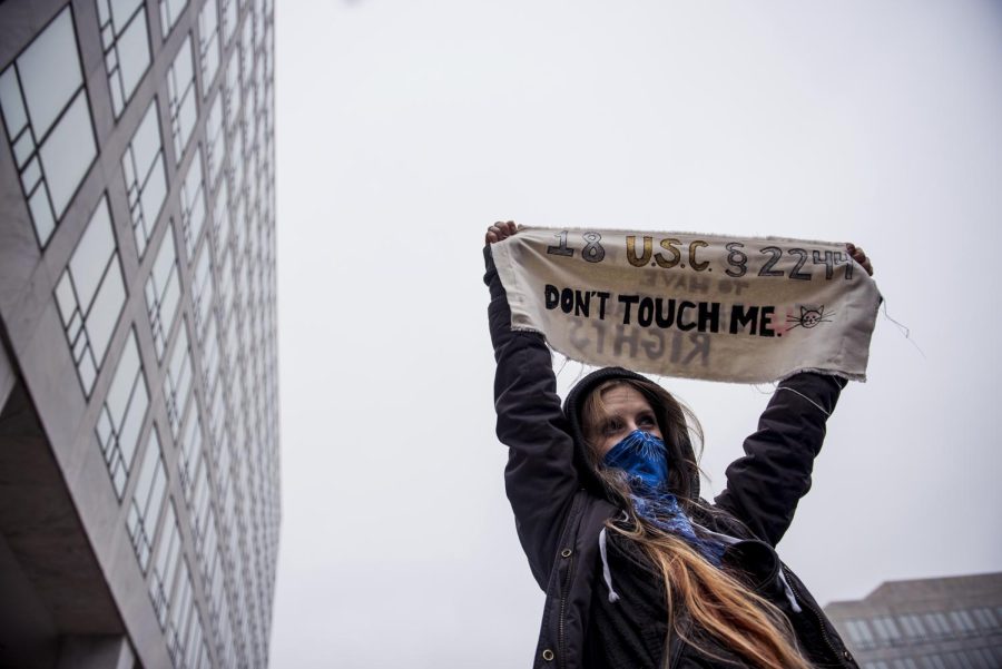 Annie Long of Virginia holds up her sign at the Women’s March in Washington on Saturday, Jan. 21, 2017. “I’m protesting because we should not allow a president who breaks federal statues to remain in office,” she said.