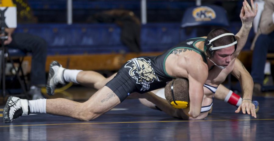 Kent State junior Chance Driscoll fights against Ohio red-shirt junior Noah Forrider at the M.A.C. Center on Sunday, Jan. 22, 2017. Kent State out 2-43.