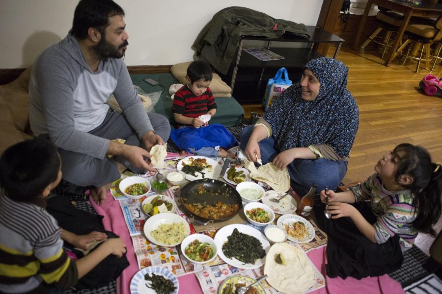 The family enjoys a homecooked meal after the end of a long day.