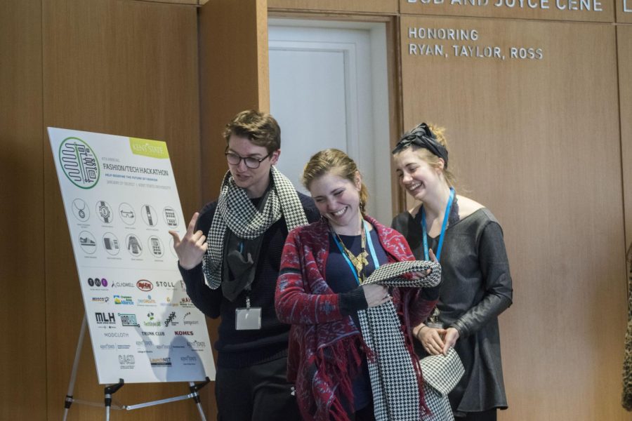 University of Pittsburgh senior math major Connor Stout and Kent State fashion design majors junior Olivia Pickard and sophomore Elizabeth Tarleton celebrate after winning during the Fashion Tech Hackathon Awards Ceremony at the College of Architecture &amp; Environmental Design building on Sunday, Jan. 29, 2017.