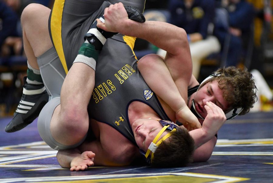 Sophomore Devin Nye battles back and forth across the mat with his opponent from Eastern Michigan University Sunday Feb. 5, 2017. Kent would lose 12-27 against Michigan.