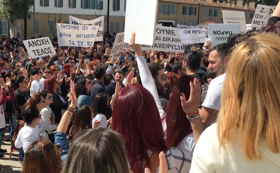 Nurses gather at the Cypriot Parliament's House of Representatives to demand changes to higher education policies.