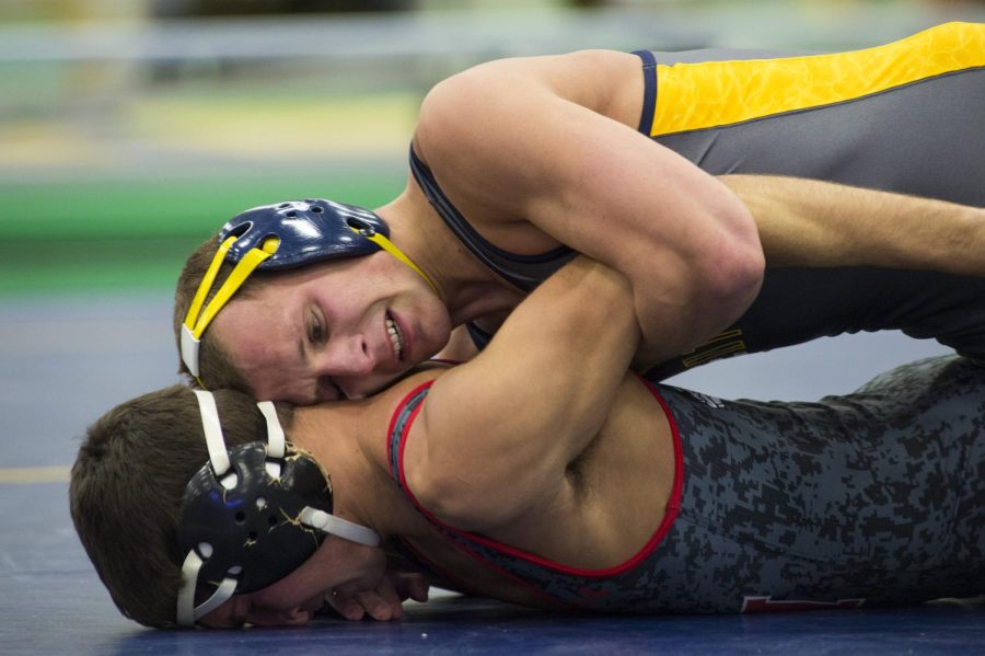 Kent State freshman Cory Simpson wrestles against Gardner-Webb sophomore Landon LoAlbo at the Kent State Field House on Saturday, Dec. 16, 2016. Simpson won by major decision 14-6.