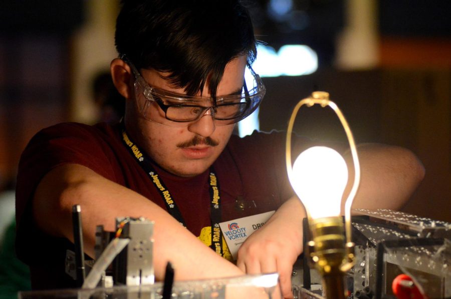 Dakota Hatch, a student at the Horizon Science Academy, is repairing his teams robot for Kent State University’s FIRST Tech Challenge Robotics Competition Saturday Feb. 4, 2017.