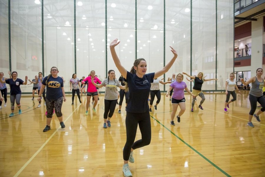 Early childhood education major Hannah Maxwell leads a Zumba dance workout in the Student Recreation and Wellness center on Thursday, Feb. 23, 2017.