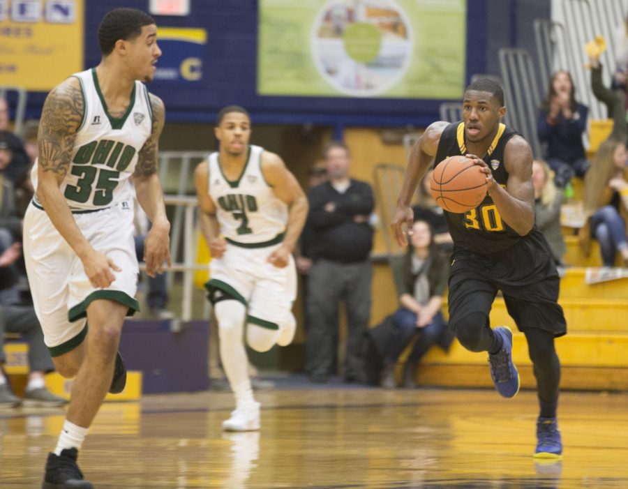 Kent State senior guard Deon Edwin rushes up court against Ohio sophomore guard Jordan Dartis at the M.A.C. Center on Saturday, Feb. 25, 2017.