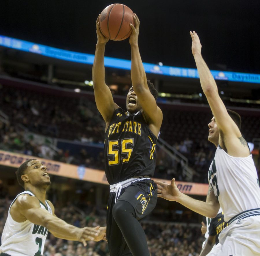 Kent State junior guard Kevin Zabo attempts layup between Ohio red-shirt guard Jaaron Simmons and red-shirt senior Kenny Kaminski during the semi-finals of the MAC Tournament at Quicken Loans Arena in Cleveland, Ohio on Friday, March 10, 2017. Kent State won 68-66.