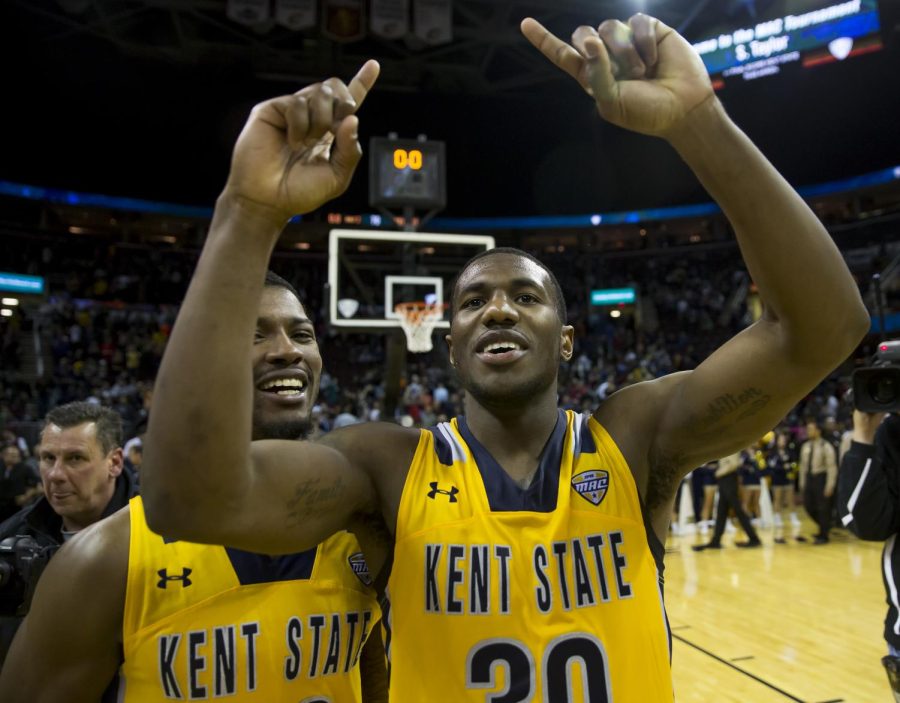 Kent State senior guard Deon Edwin and junior guard Desmond Ridenour celebrate after beating Akron 70-65 in the MAC Championship Game at Quicken Loans in Cleveland, Ohio on Saturday, March 11, 2017. Kent State has punched their ticket to the NCAA Tournament.